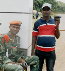 John Ndagano (right) with Samuel, one of his disciples at the military camp where he ministers.